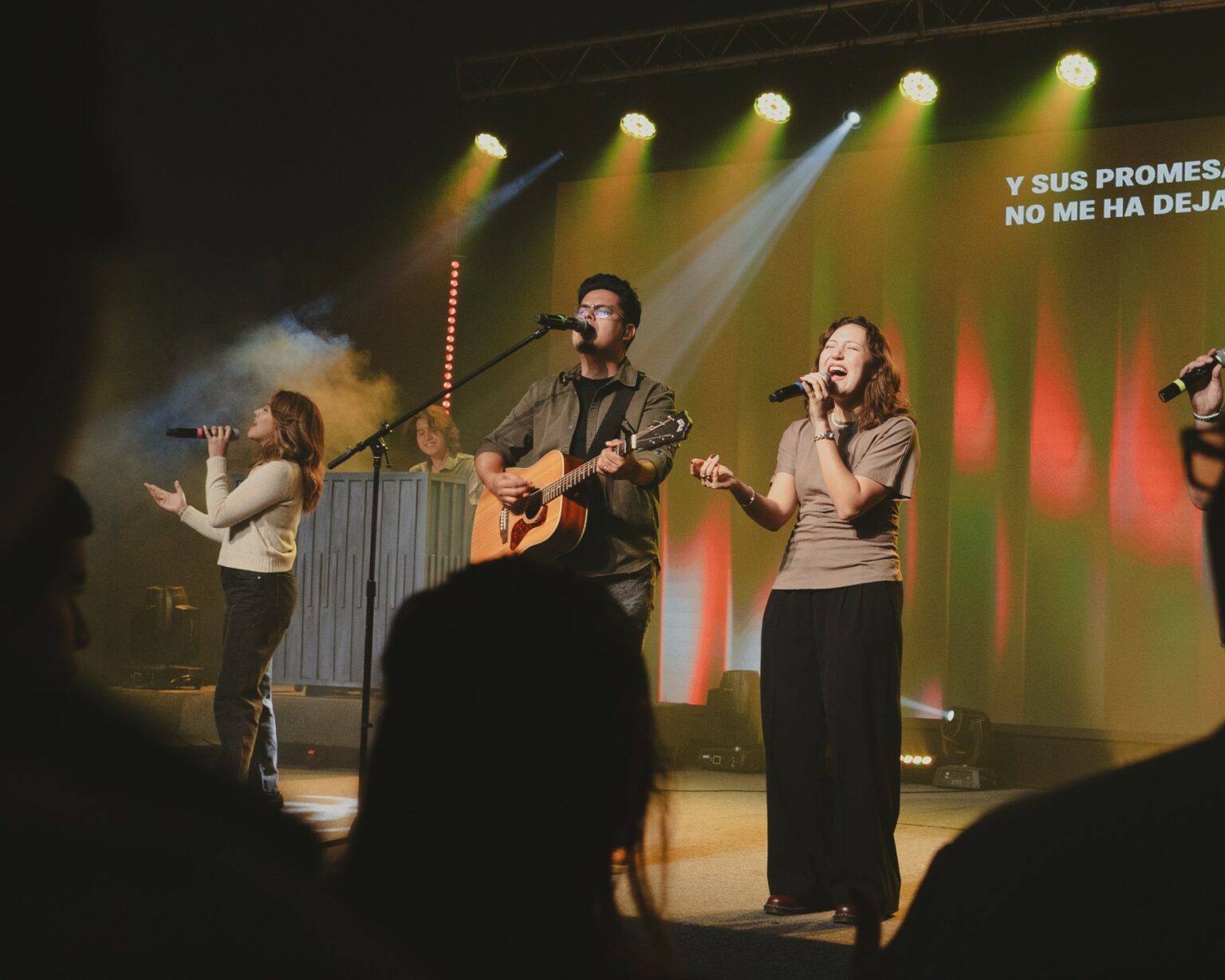 Two people singing at a worship night