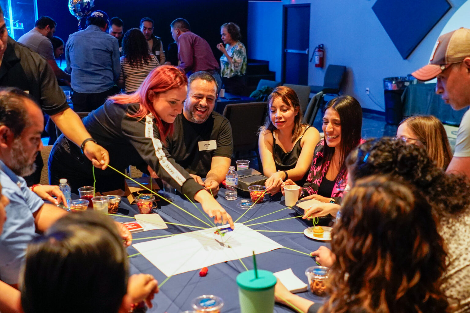 People connecting at a table during GroupLink
