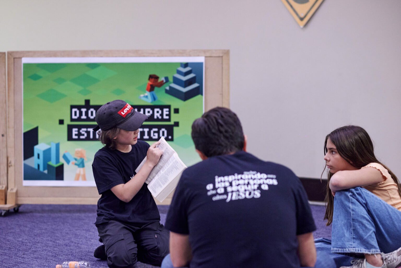 Volunteers on stage in the kids space