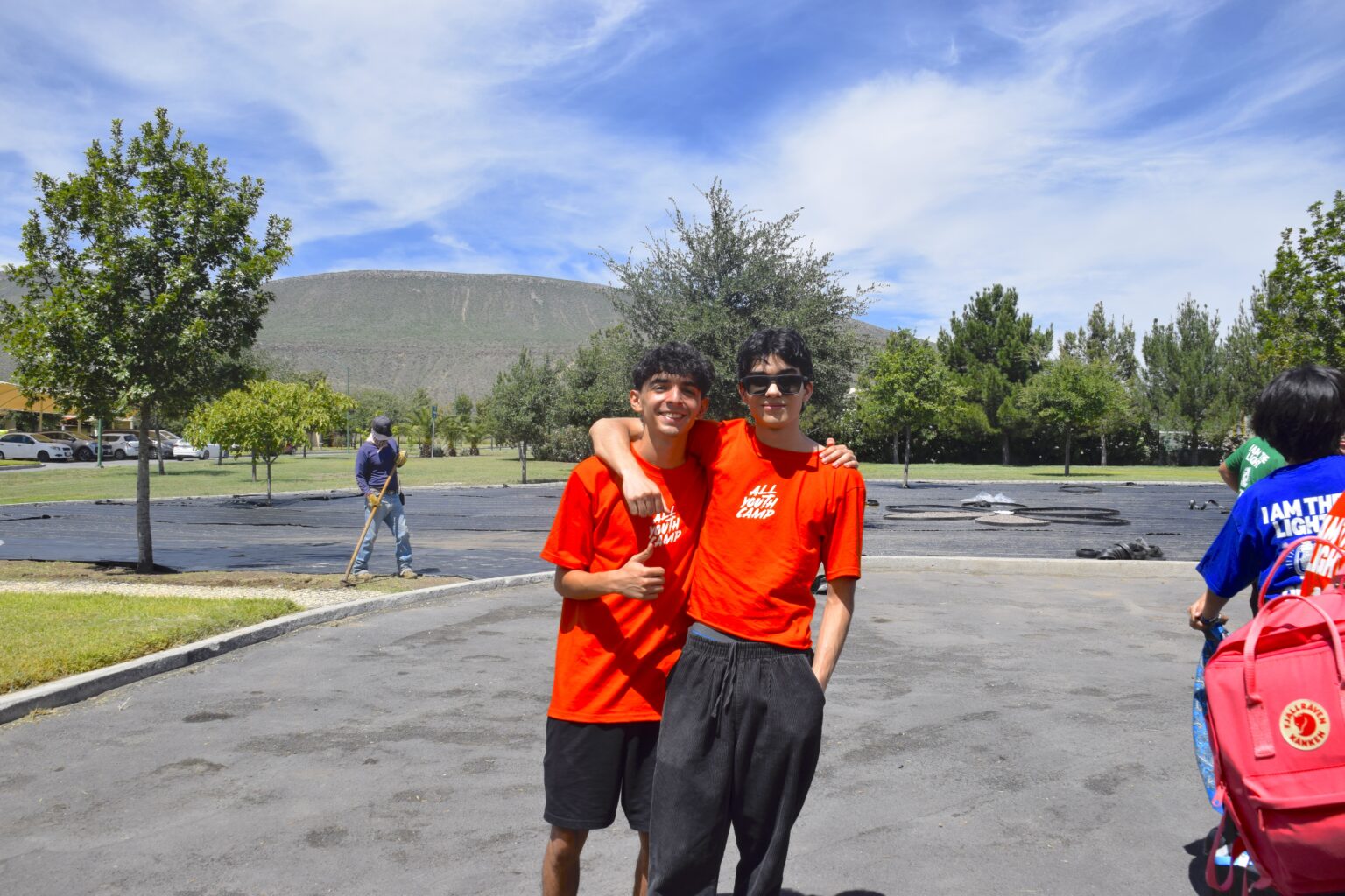 Two young people hugging at camp