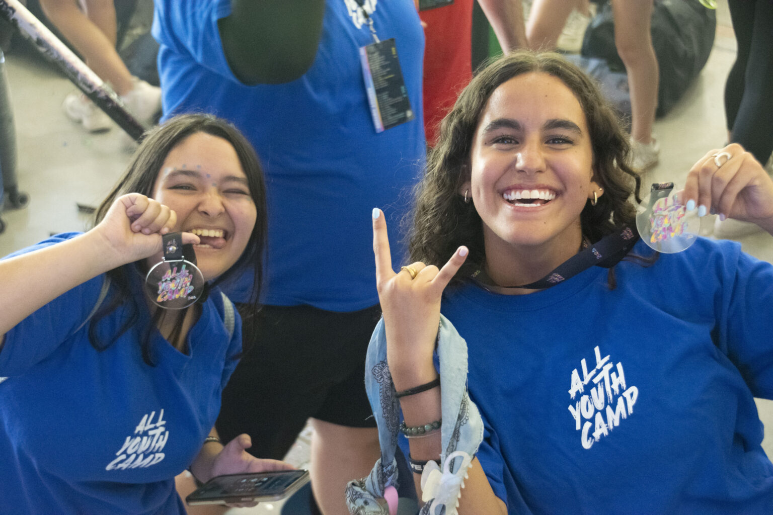 Two young people smiling at the camera at All Youth Camp