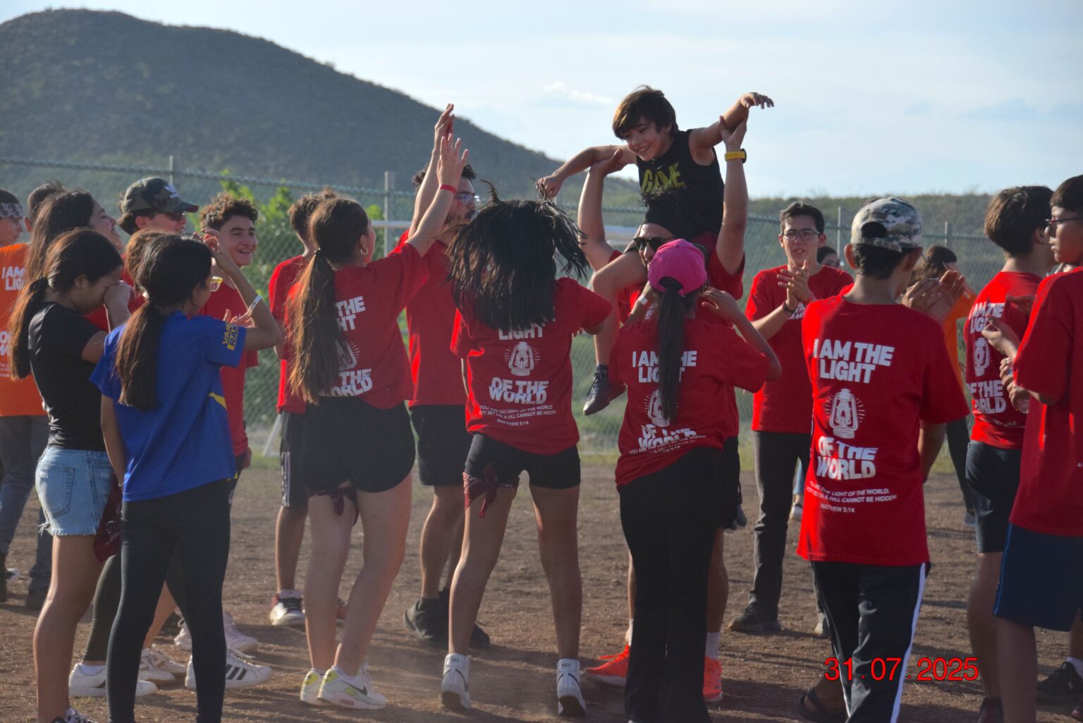 The red team cheering at camp