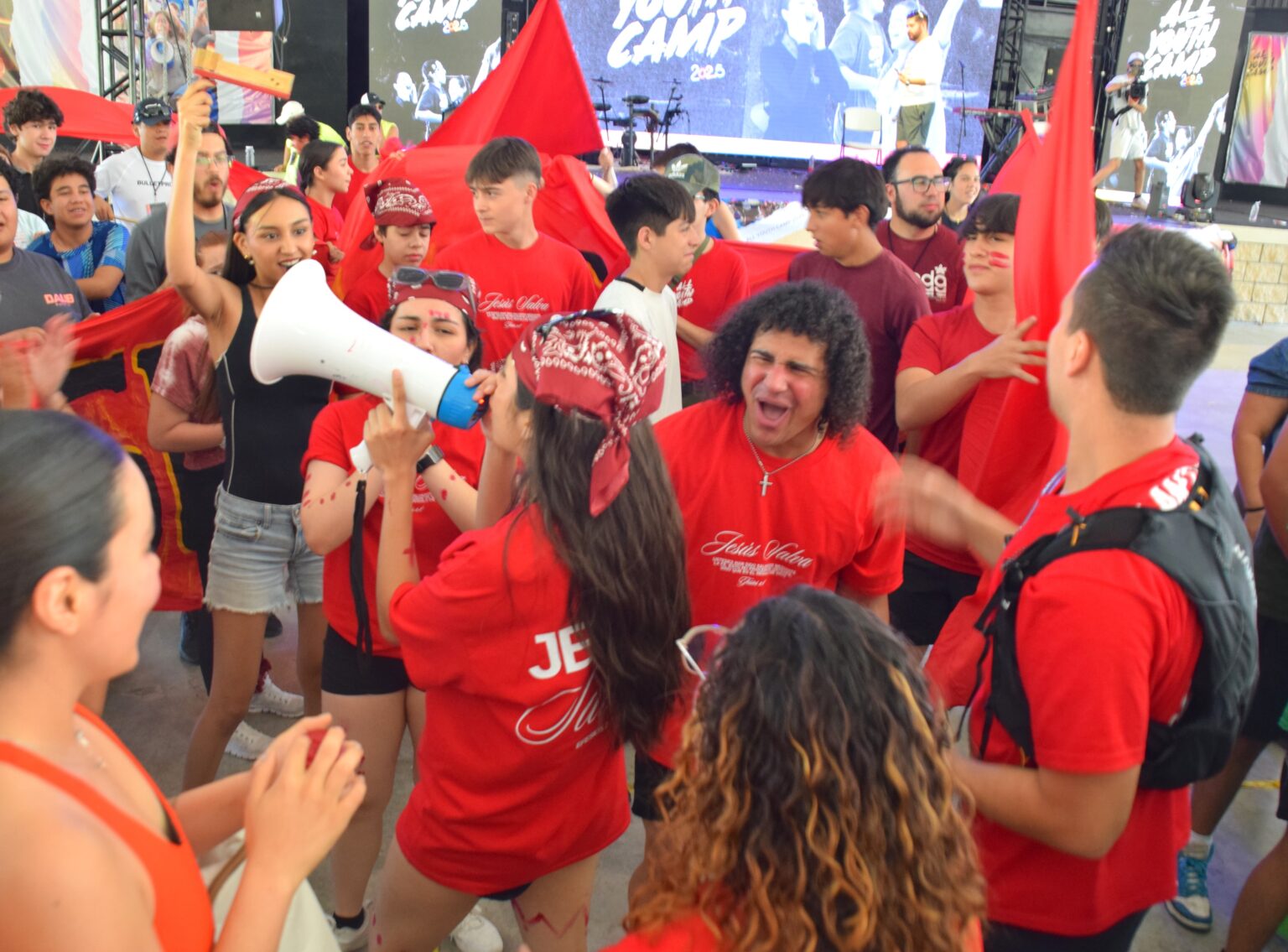 Students cheering with a megaphone during camp