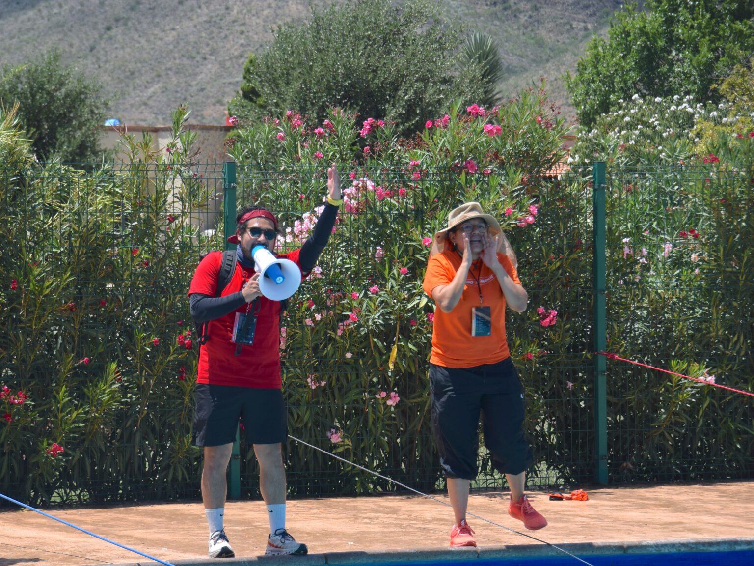 Two leaders running an activity with a megaphone